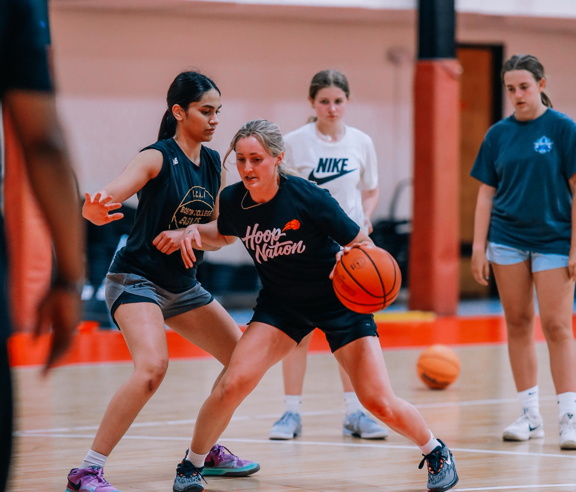 Coach working with players during a semi-private training session